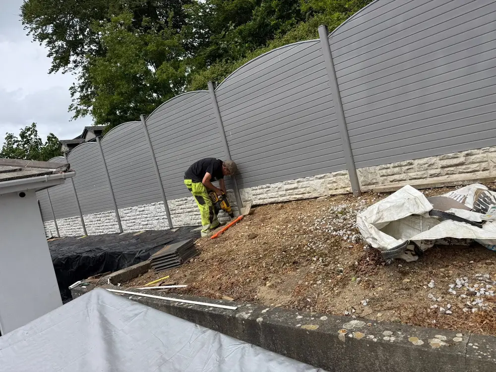 Garden fence post being installed